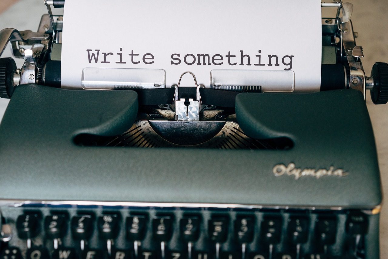 Why I Started This Blog Vintage typewriter with a sheet of paper that reads “Write something.”